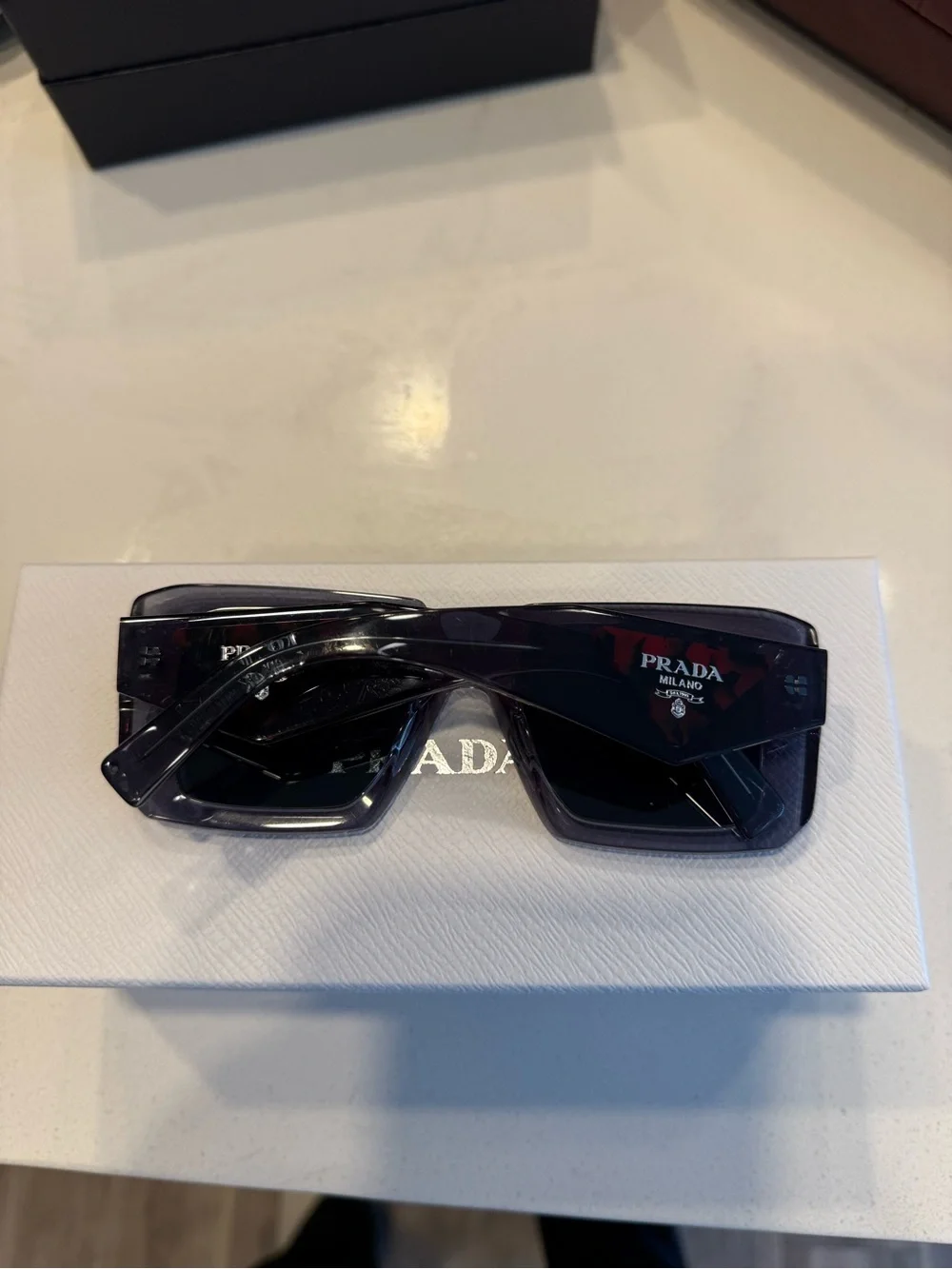 Prada Women’s Square Sunglasses in Translucent Gray with Dark Lenses